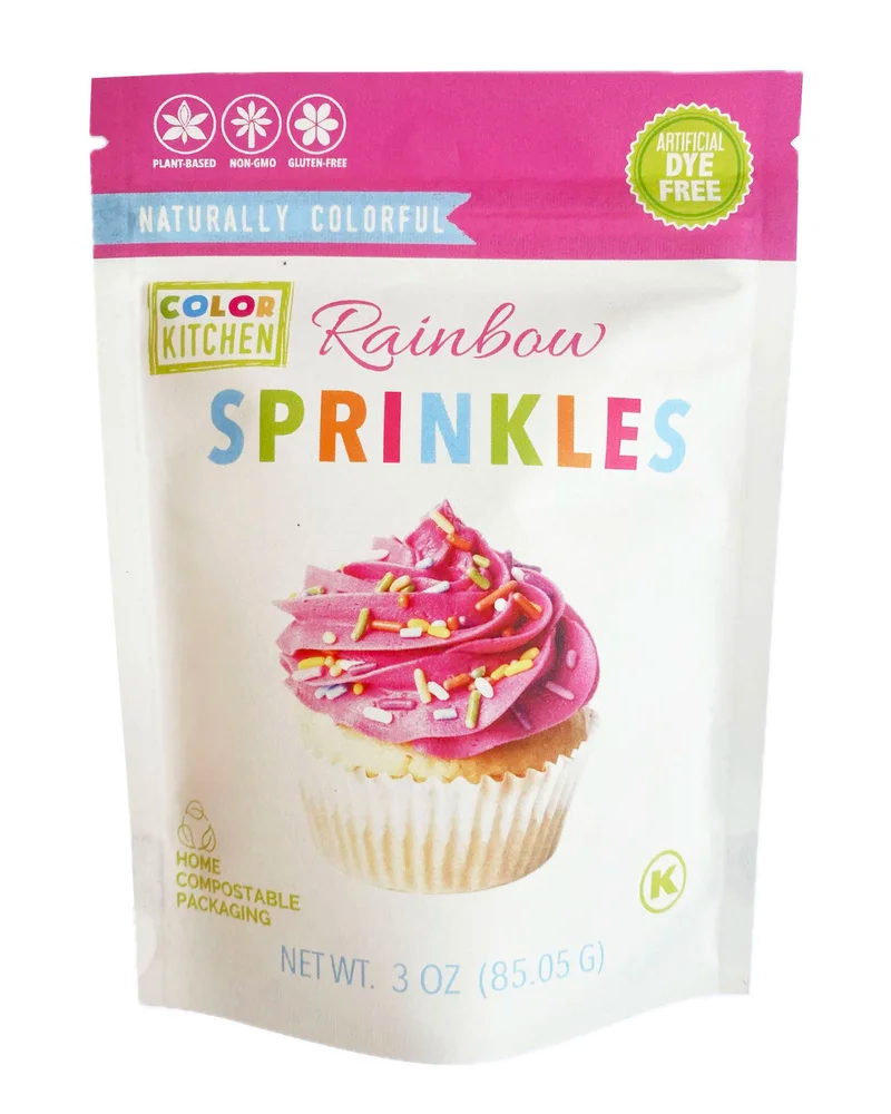 Package of Color Kitchen Rainbow Sprinkles with a cupcake illustration on a white background